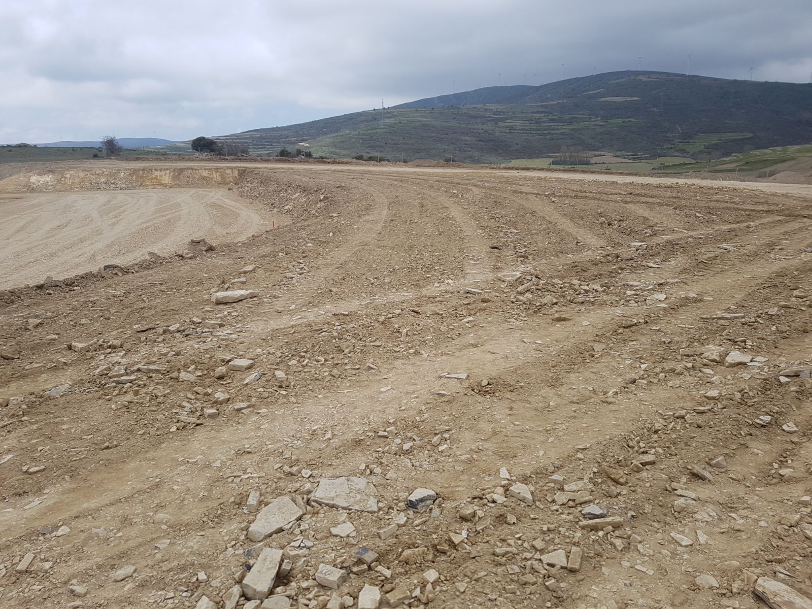 Land restored to its original elevation, covering the full extent of the excavated strip