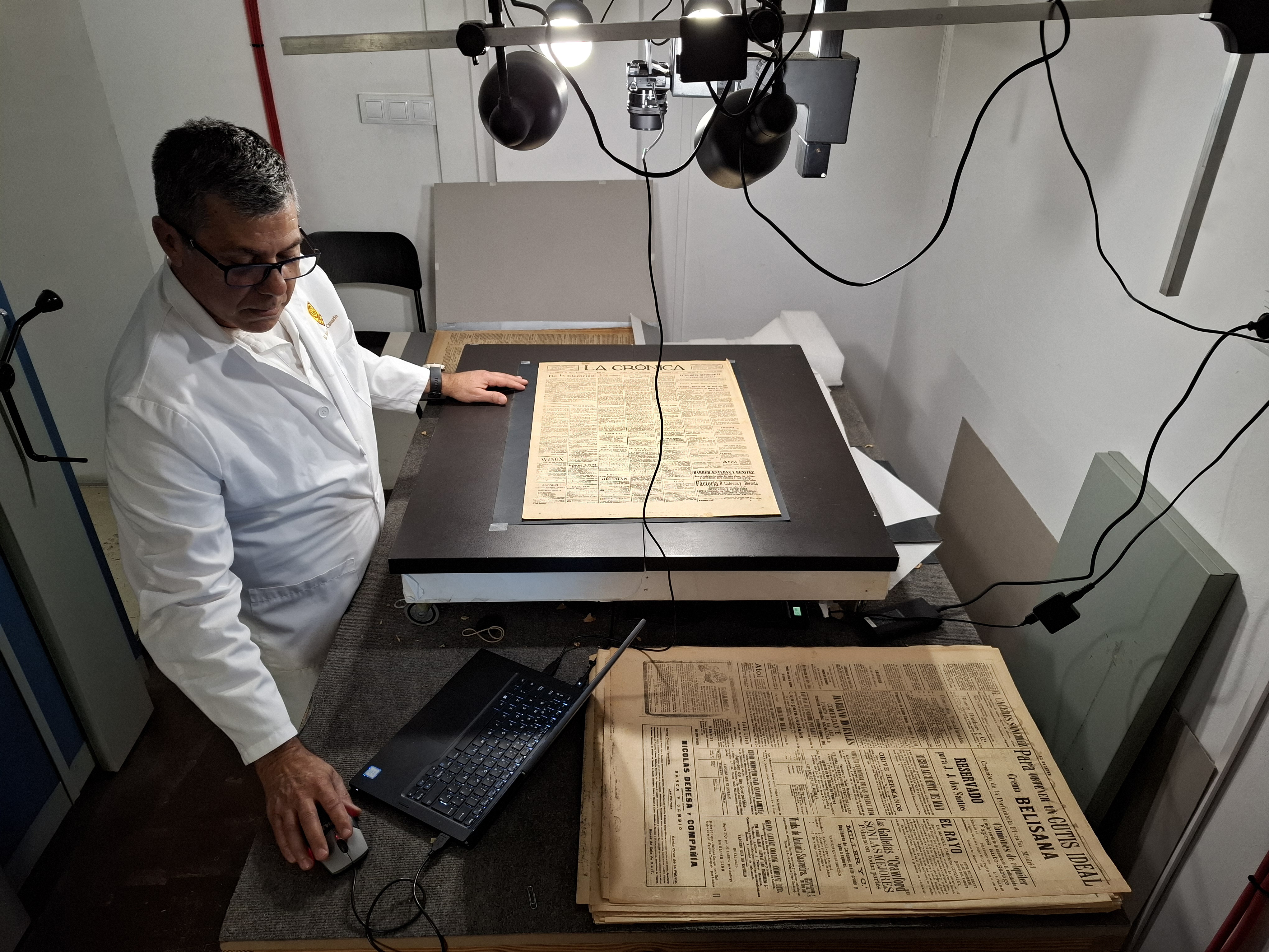 Museum technician digitizes paper newspaper archive